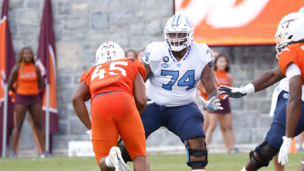 Sep 3, 2021; Blacksburg, Virginia, USA; Virginia Tech Hokies defensive lineman TyJuan Garbutt (45) rushes against North Carolina Tar Heels offensive lineman Jordan Tucker (74) during the first quarter at Lane Stadium. Mandatory Credit: Reinhold Matay-USA TODAY Sports